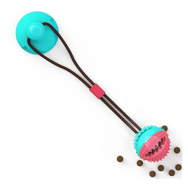Suction ball interactive dog toy stuck to a floor